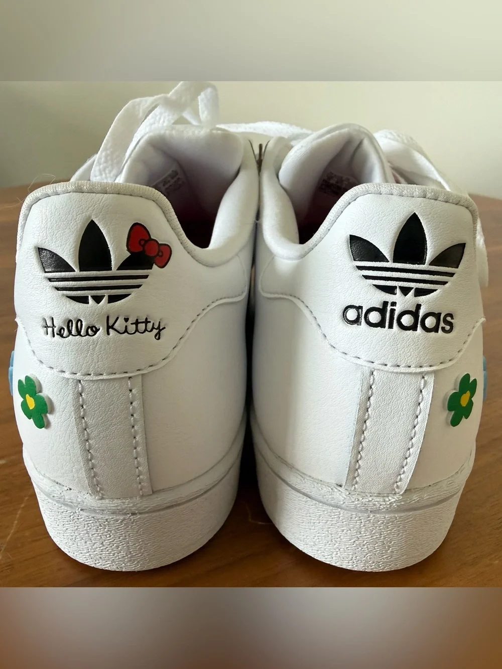 Adidas Youth Superstar J sneakers with Floral Accents & Hello Kitty Charm